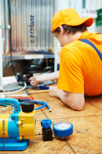 Photo: repair work on fridge appliance repair work on fridge appliance