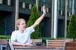 Young man is asking for waiter in cafe Young man is asking for waiter in cafe