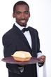 Waiter holding tray with fast food container