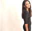 Young sexy brunette woman walking into frame