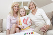 Mother, Daughter, Grandmother Generations at Home wih Heart Pict