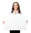 Smiling businesswoman showing blank signboard, isolated