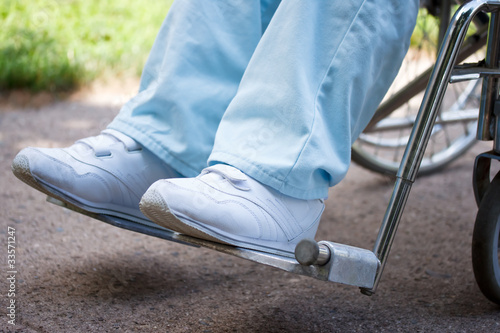 Photo: Legs and feet of woman sitting in wheelchair Legs and feet of woman sitting in wheelchair