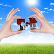 hands holding house hands holding house