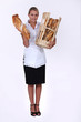 Blond bakery worker holding bread
