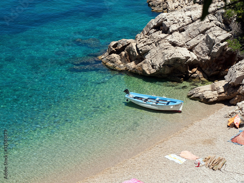 Photo: Small fishing boat near the beach Small fishing boat near the beach