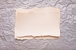 ripped piece of paper on old crushed paper background. vintage r ripped piece of paper on old crushed paper background. vintage r