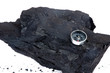a lump of coal and compass