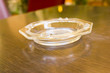 Glass ashtray on a table