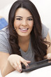 Happy Hispanic Woman Using Tablet Computer