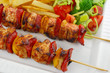 Chicken skewers and french fries