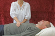 Healer channelling energy to solar plexus chakra