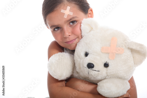 Photo: Girl and teddy with a plaster Girl and teddy with a plaster