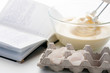 Whisk with eggs in a bowl