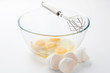 Whisk with eggs in a bowl