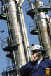 oil worker and refinery towers
