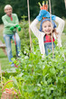 Gardening - little gardener with mother in vegetable garden Gardening - little gardener with mother in vegetable garden