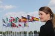 portrait of a woman with flags in the background