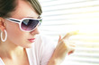 Photo: girl looking through the blinds girl looking through the blinds