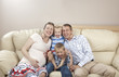 Photo: Family sitting on the sofa Family sitting on the sofa