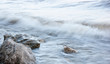 surf on rocky shore