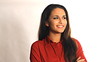 Smiling young business woman in studio