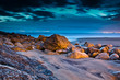 Sunset on the stones beach in Portugal