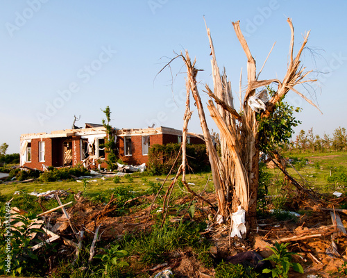 Photo: Tornado-damaged land and home in northern Alabama Tornado-damaged land and home in northern Alabama