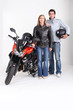 Biking couple with a red motorcycle