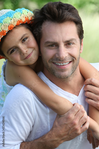Foto: Girl on father's back Girl on father's back