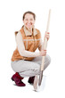 Happy  woman sits with spade