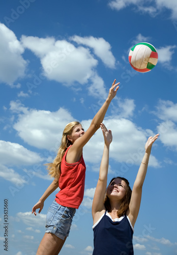 Photo: girls playing volleyball girls playing volleyball