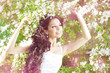 Beautiful bride in a blossoming garden