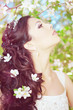 Beautiful bride in a blossoming garden
