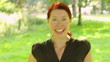 Redhaired woman opening her hair