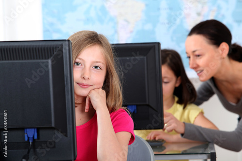 Photo: Portrait of blond school girl in class Portrait of blond school girl in class