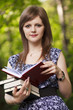 Pretty lady holding books