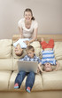 Photo: Children and mother on the sofa having fun Children and mother on the sofa having fun