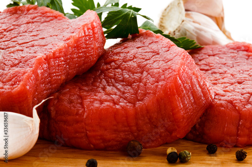 Photo: Raw beef on cutting board Raw beef on cutting board