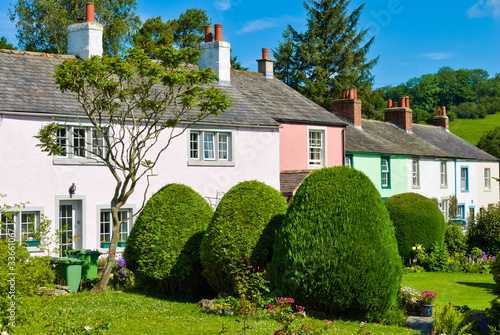 Photo: Row of coloured village cottages Row of coloured village cottages