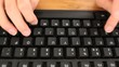 Female hands on a keyboard