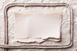 ripped piece of paper and rope on old crushed paper background. ripped piece of paper and rope on old crushed paper background.
