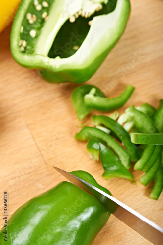 Photo: chopping sweet peppers on a chopping board chopping sweet peppers on a chopping board