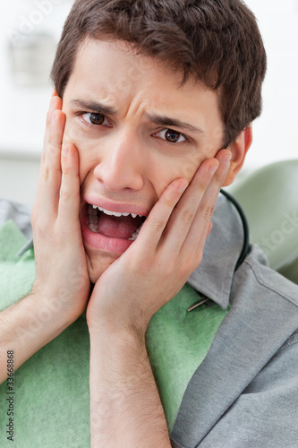 Photo: Scared man in Dental Clinic Scared man in Dental Clinic