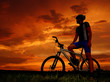 Photo: mountain biker silhouette in sunrise mountain biker silhouette in sunrise