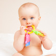 Infant with teething toy