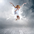 Jump of ballerina with dress of milk