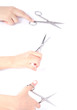 Hand holding scissors