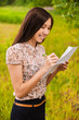young businesswoman writing something on paper
