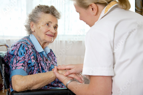 Photo: Senior woman with her home caregiver Senior woman with her home caregiver